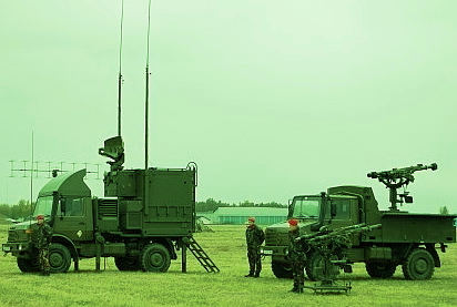 Mistral Missile System  military personnel and vehicles with missiles on a field